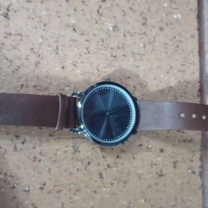 Men's watch brown leather strap. Dark silver and a glossy blue background.